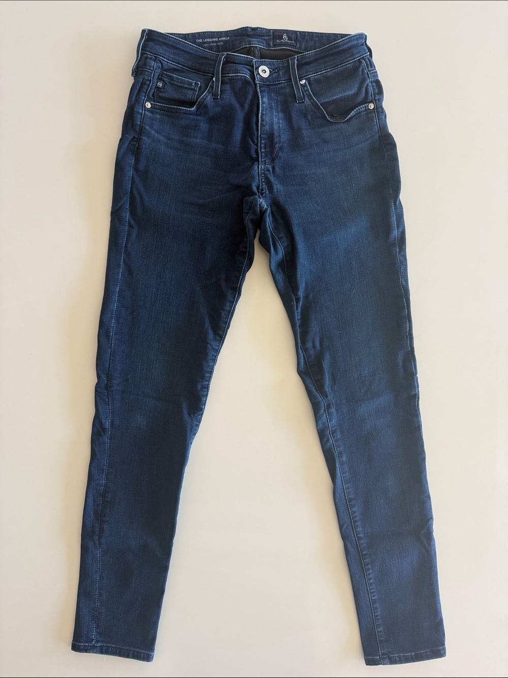 AG Denim The Legging Ankle Jeans, size 26. Darker solid wash